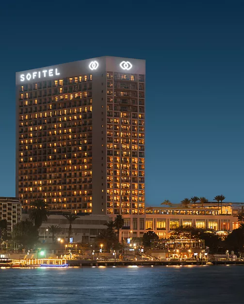 Exterior view of Sofitel Cairo Downtown Nile at dusk